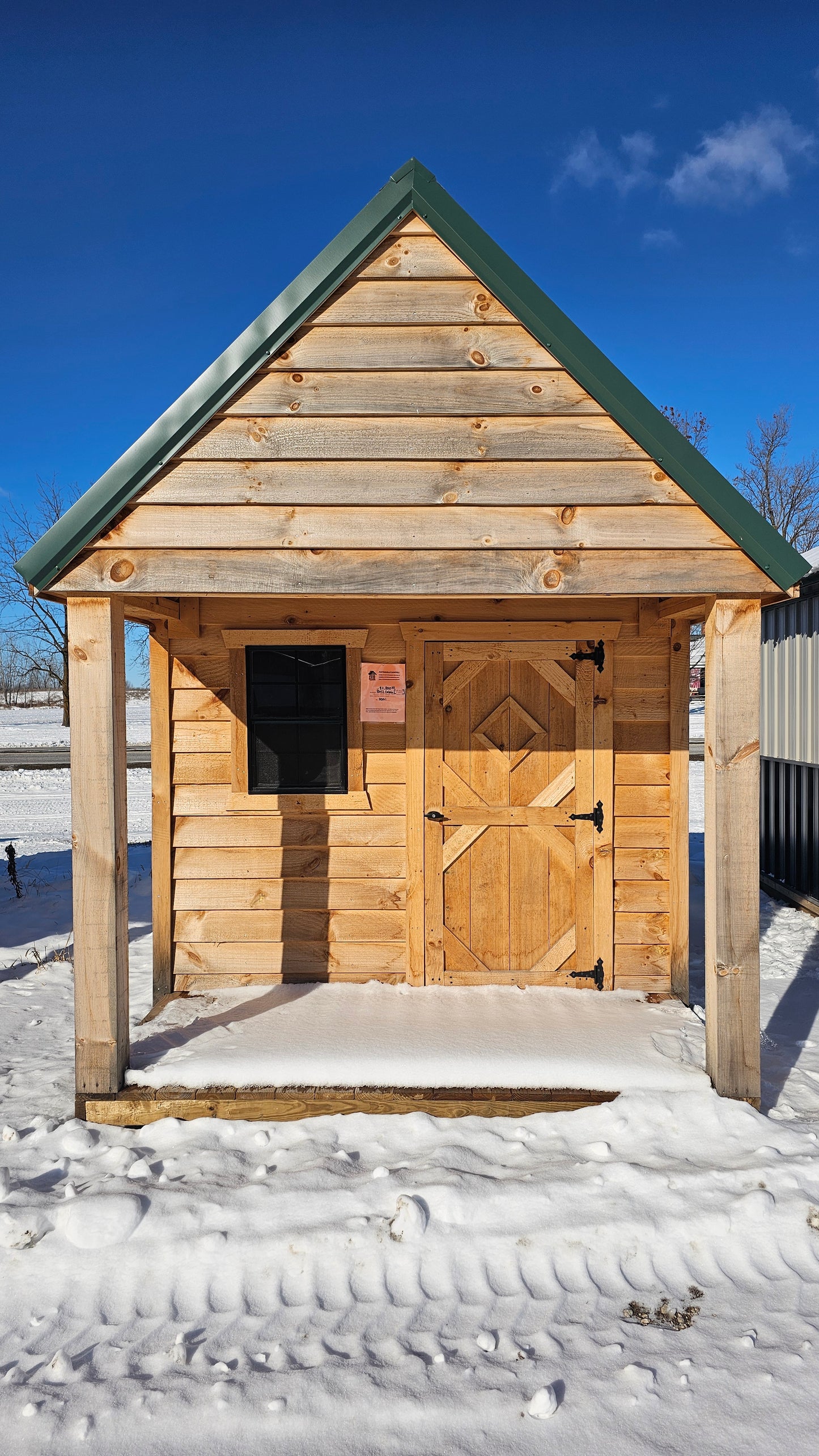8×12 Rough Sawn Cabin with 8×8 Enclosed 4′ Porch – Green Steel Roof