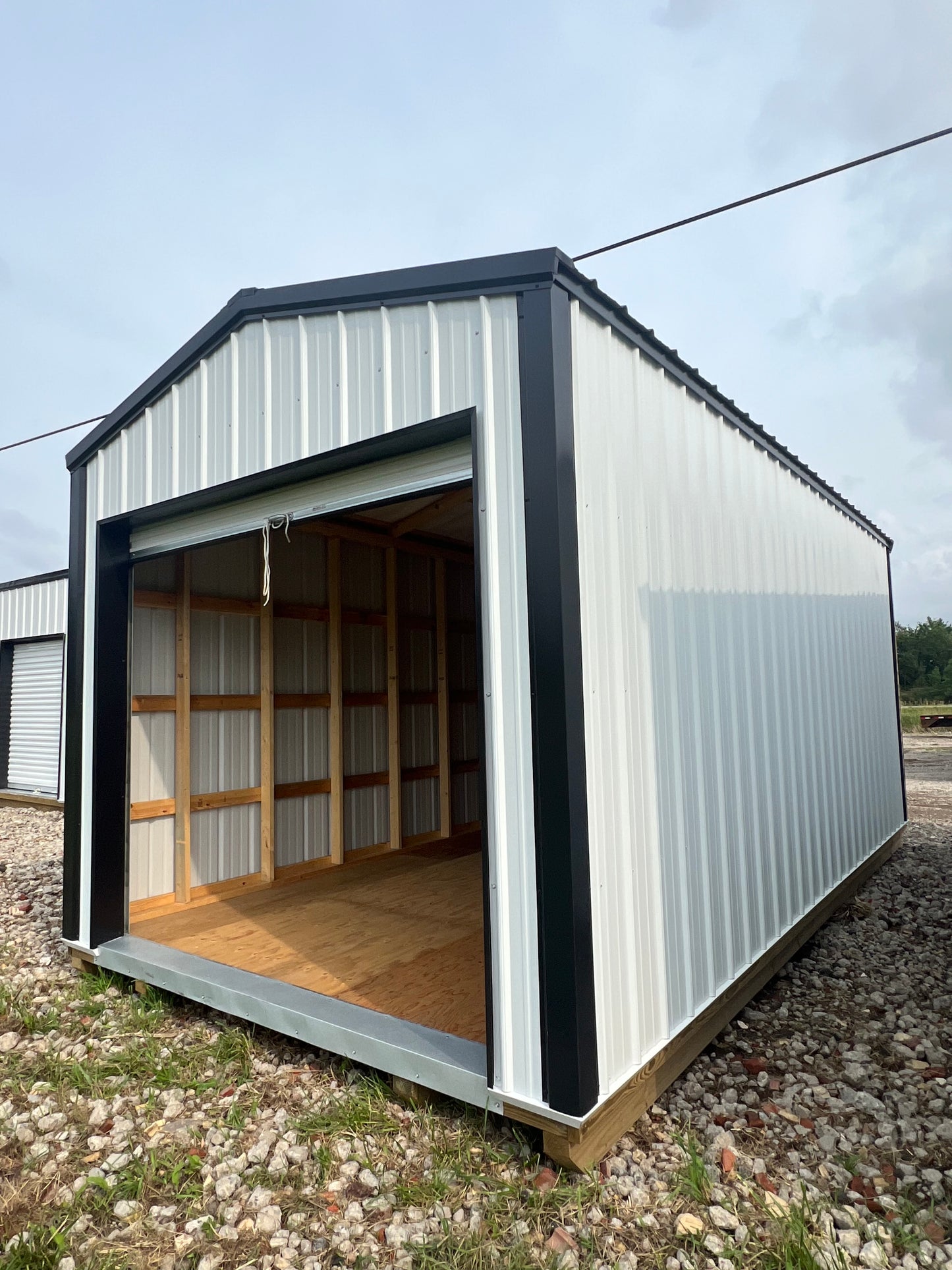 10x20 white steel shed with 8' roll up door