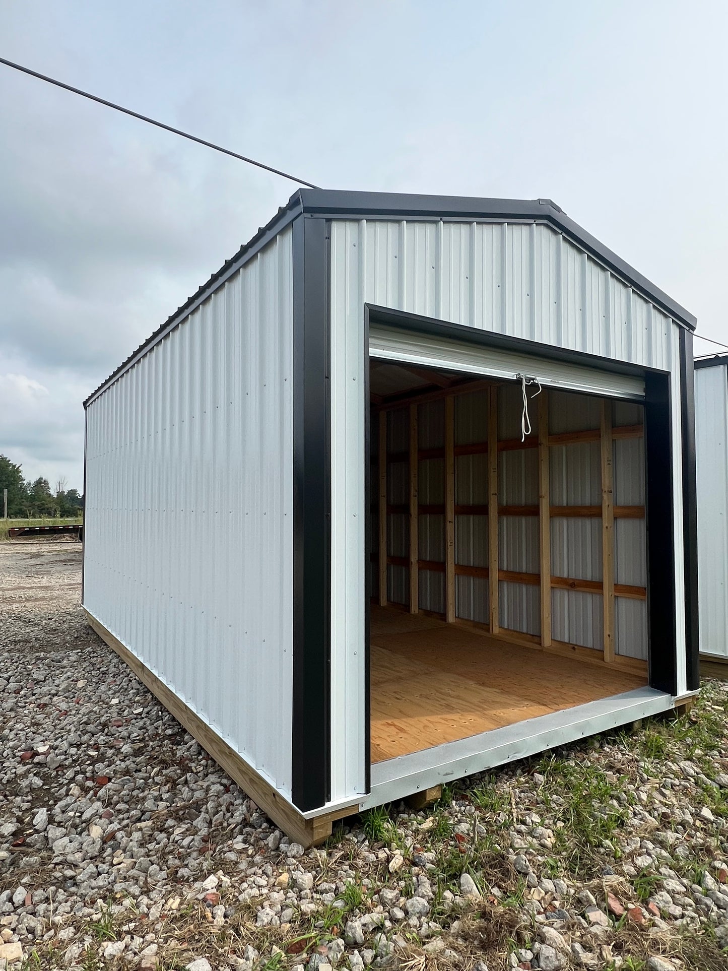 10x20 white steel shed with 8' roll up door