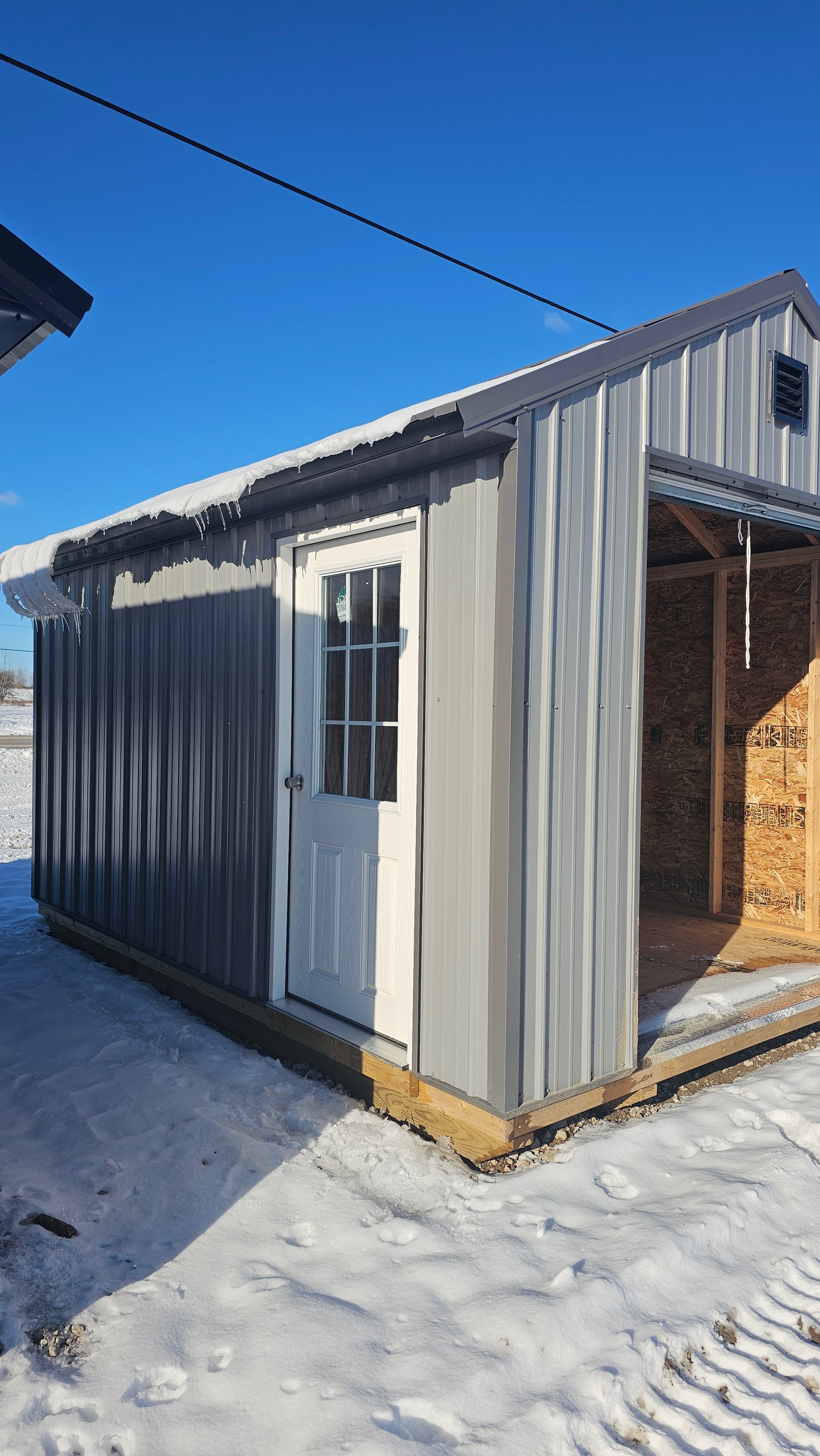10×14 Steel Shed – 6′ Roll-Up Door & Side Entry with Glass