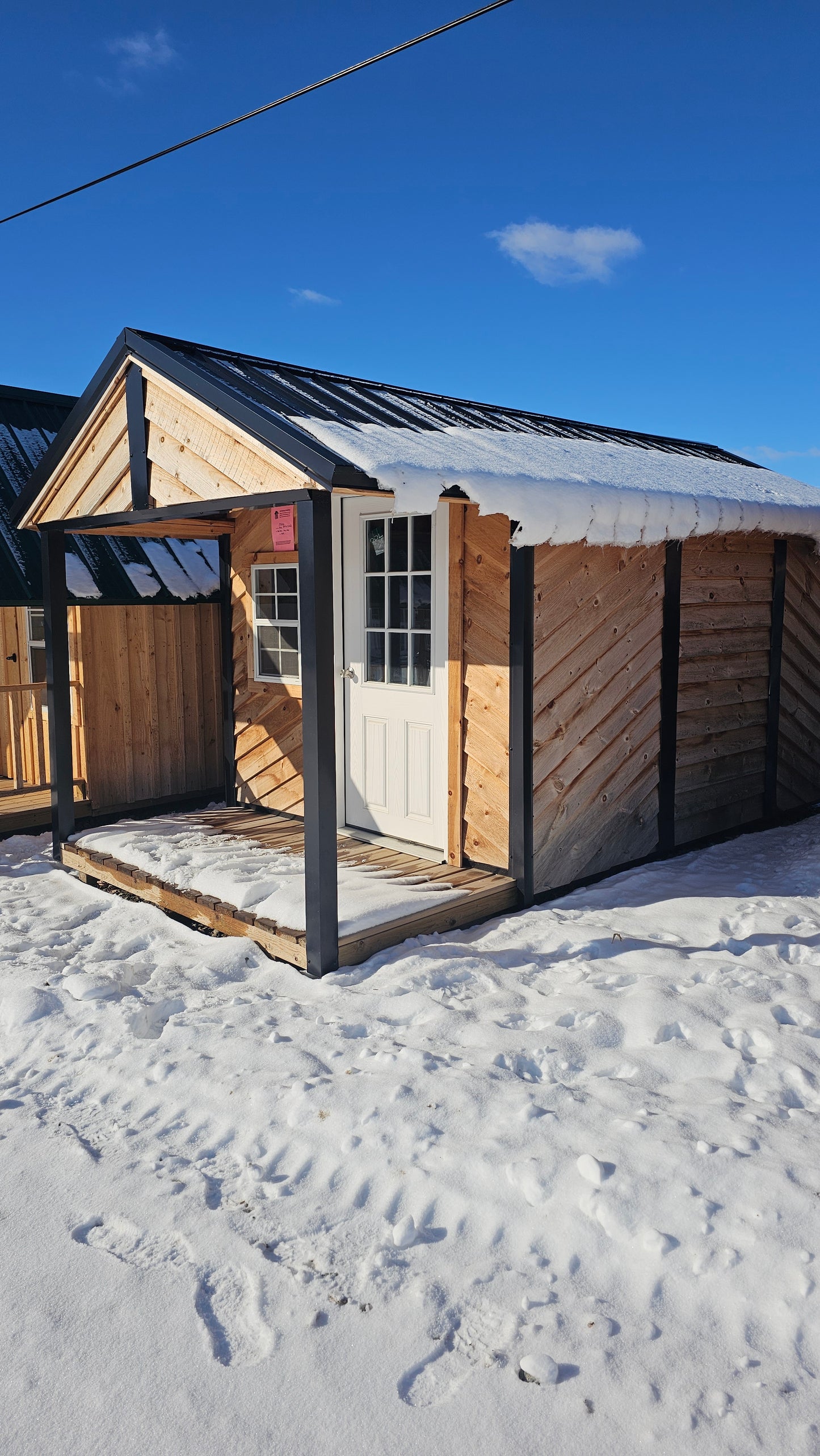 8×16 Cabin-Style Shed (8×12) with 4′ Porch – Black Roof – DIAG Siding